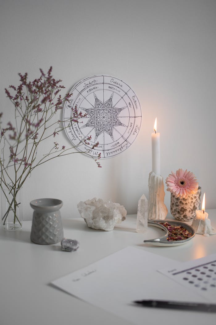 hero-img-01 A serene pagan altar with candles, crystals, and a Wheel of the Year chart.